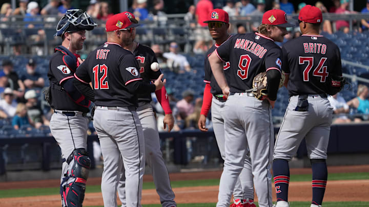 Feb 26, 2026; Peoria, Arizona, USA; Cleveland Guardians manager Stephen Vogt (12) visits the mound against the Seattle Mariners in the first inning at Peoria Sports Complex. Mandatory Credit: Rick Scuteri-Imagn Images