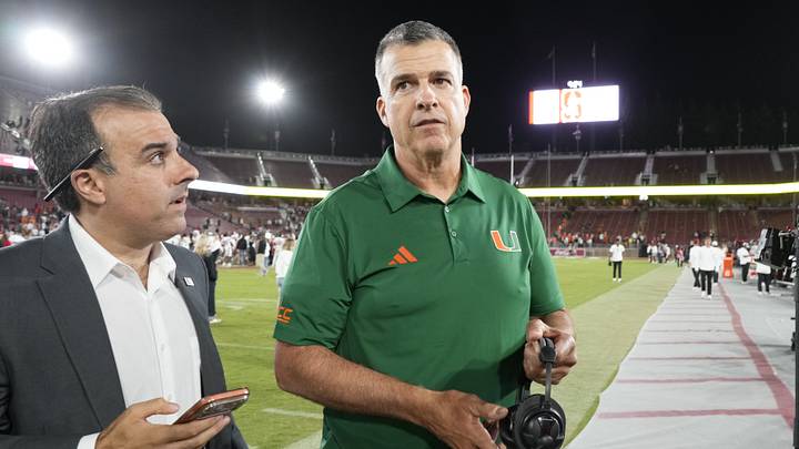 Sep 4, 2026; Stanford, California, USA;  Miami Hurricanes head coach Mario Cristobal prepares for an interview after defeating the Stanford Cardinal at Stanford Stadium.  Mandatory Credit: Stan Szeto-Imagn Images