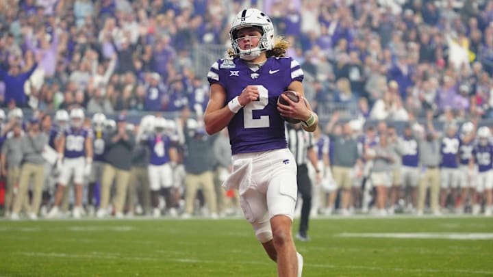 Kansas State quarterback Avery Johnson (2) scores a touchdown against Rutgers during the first half of the Rate Bowl at Chase Field on Dec. 26, 2024, in Phoenix. Kansas State quarterback Avery Johnson (2) scores a touchdown against Rutgers during the first half of the Rate Bowl at Chase Field on Dec. 26, 2024, in Phoenix.