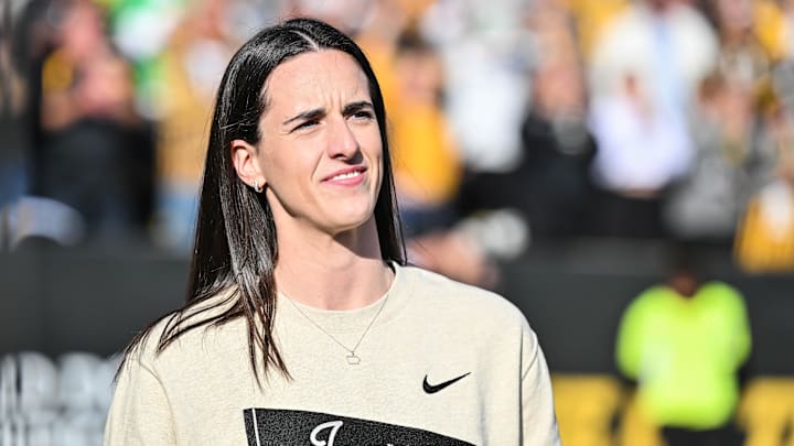 Oct 26, 2024; Iowa City, Iowa, USA; Former Iowa Hawkeye and current Indiana Fever WNBA star Caitlin Clark looks on while being honored during the game between the Iowa Hawkeyes and the Northwestern Wildcats at Kinnick Stadium. Oct 26, 2024; Iowa City, Iowa, USA; Former Iowa Hawkeye and current Indiana Fever WNBA star Caitlin Clark looks on while being honored during the game between the Iowa Hawkeyes and the Northwestern Wildcats at Kinnick Stadium.