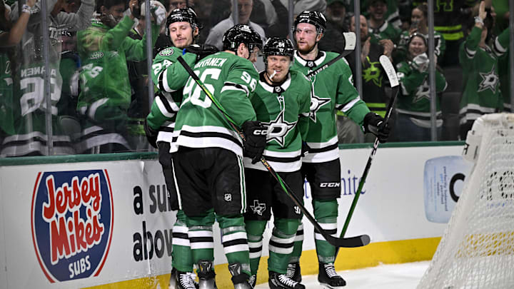 May 13, 2025; Dallas, Texas, USA; Dallas Stars right wing Mikko Rantanen (96) and center Roope Hintz (24) and center Mikael Granlund (64) and defenseman Thomas Harley (55) celebrates a goal scored by Granlund against the Winnipeg Jets during the second period in game four of the second round of the 2025 Stanley Cup Playoffs at American Airlines Center. Mandatory Credit: Jerome Miron-Imagn Images