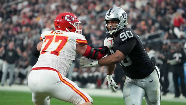 Jan 7, 2023; Paradise, Nevada, USA; Las Vegas Raiders defensive tackle Jerry Tillery (90) attempts to get past Kansas City Chiefs guard Andrew Wylie (77) at Allegiant Stadium. Mandatory Credit: Kirby Lee-USA TODAY Sports
