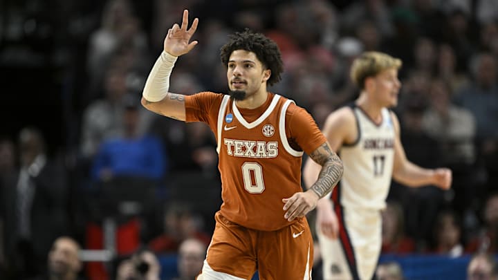 Mar 21, 2026; Portland, OR, USA; Texas Longhorns guard Jordan Pope (0) reacts after a basket in the second half against the Gonzaga Bulldogs during a second round game of the men's 2026 NCAA Tournament at Moda Center. Mandatory Credit: Craig Strobeck-Imagn Images