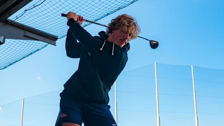 Ole Miss quarterback Jaxson Dart takes a swing at Topgolf in Jacksonville. Ole Miss quarterback Jaxson Dart takes a swing at Topgolf in Jacksonville.