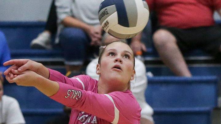 Regina Catholic’s Reese Naeve (6) passes the ball against Mid-Prairie Tuesday, Oct. 8, 2024 in Iowa City, Iowa.