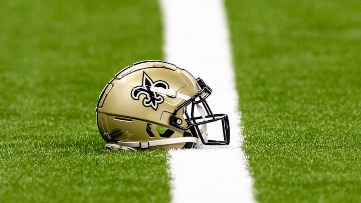 Aug 25, 2024; New Orleans, Louisiana, USA; New Orleans Saints helmet on the turf during warmups before the game against the Tennessee Titans at Caesars Superdome. Mandatory Credit: Stephen Lew-Imagn Images Aug 25, 2024; New Orleans, Louisiana, USA; New Orleans Saints helmet on the turf during warmups before the game against the Tennessee Titans at Caesars Superdome. Mandatory Credit: Stephen Lew-Imagn Images