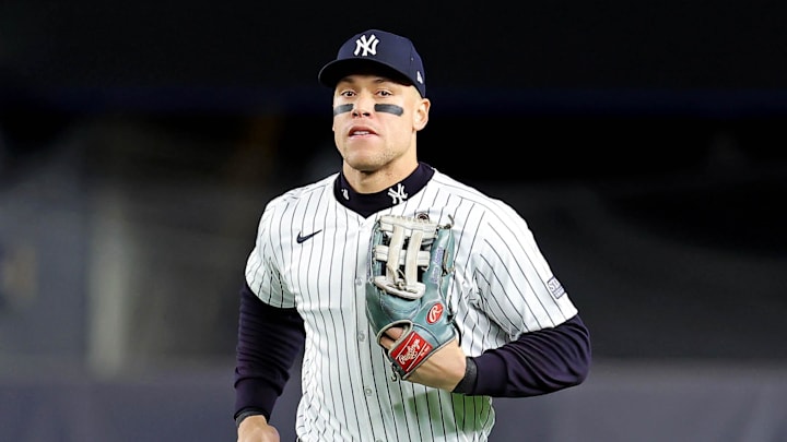 New York Yankees outfielder Aaron Judge runs into the dugout after the second inning against the Los Angeles Dodgers in Game 3 of the 2024 MLB World Series at Yankee Stadium. 