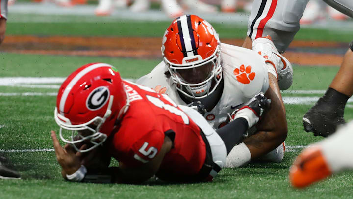 Clemson defensive lineman Peter Woods (11) sacks Georgia quarterback Carson Beck (15) during the first half of the NCAA Aflac Kickoff Game against Clemson in Atlanta, on Saturday, Aug. 31, 2024.