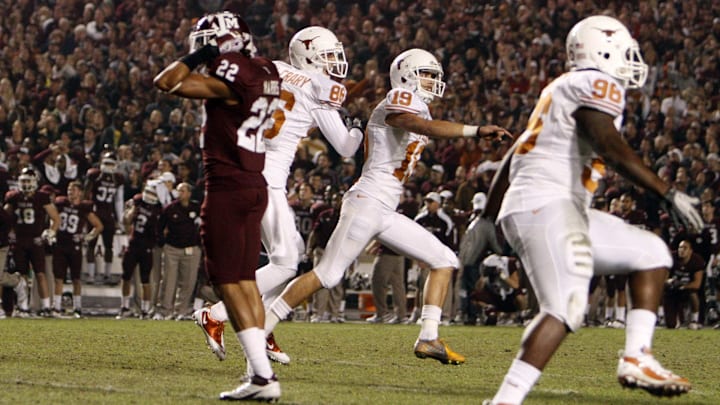 Nov 24, 2011; College Station, TX, USA; Texas Longhorns kicker Justin Tucker (19) celebrates after kicking the game-winning field goal against the Texas A&M Aggies at Kyle Field. Texas won 27-25. Mandatory Credit: Thomas Campbell-US Presswire