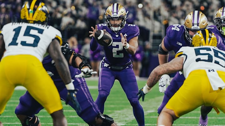 Demond Williams Jr. takes a shotgun snap and prepares to deal against Michigan. 