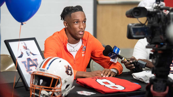 Cam Coleman is interviewed as he signed to play football with Auburn University at Central High