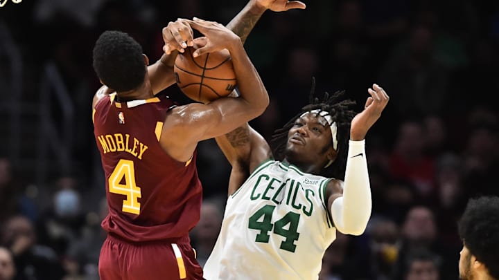 Nov 13, 2021; Cleveland, Ohio, USA; Cleveland Cavaliers center Evan Mobley (4) and Boston Celtics center Robert Williams III (44) fight for a rebound during the second half at Rocket Mortgage FieldHouse. Mandatory Credit: Ken Blaze-Imagn Images
