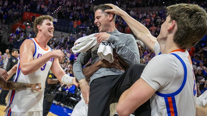 Florida celebrate Florida head coach Todd Golden’s 100th win and beating Mississippi State 108-77 after an NCAA mens basketball game at Steven C. O'Connell Center Exactek arena in Gainesville, FL on Tuesday, March 3, 2026. [Alan Youngblood/Gainesville Sun]