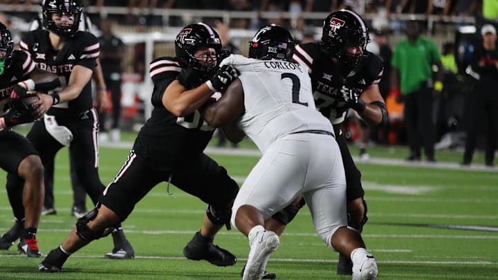 Sep 28, 2024; Lubbock, Texas, USA;  Texas Tech Red Raiders offensive lineman Davion Carter (56) blocks Cincinnati Bearcats defensive tackle Dontay Corleone (2) in the first half at Jones AT&T Stadium and Cody Campbell Field. Mandatory Credit: Michael C. Johnson-Imagn Images