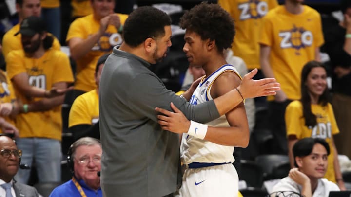 Dec 11, 2024; Pittsburgh, Pennsylvania, USA;  Pittsburgh Panthers head coach Jeff Capel (left) embraces guard Brandin Cummings (3) against the Eastern Kentucky Colonels during the second half at the Petersen Events Center. Mandatory Credit: Charles LeClaire-Imagn Images