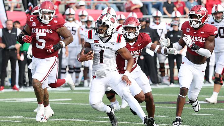 Sep 6, 2025; Little Rock, Arkansas, USA; Arkansas Razorbacks quarterback Jaylen Raynor (1) rushes in the second quarter against the Arkansas State Red Wolves at War Memorial Stadium. Mandatory Credit: Nelson Chenault-Imagn Images