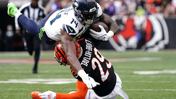 Cincinnati Bengals cornerback Cam Taylor-Britt (29) tackles Seattle Seahawks wide receiver DK Metcalf (14) following a catch in the fourth quarter during an NFL football game between the Seattle Seahawks and the Cincinnati Bengals Sunday, Oct. 15, 2023, at Paycor Stadium in Cincinnati. The Cincinnati Bengals won, 17-13.