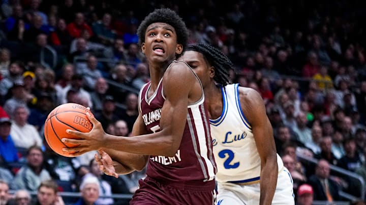 Columbus Academy's Jason Singleton (5) drives the ball to the basket against Lutheran East's DJ Jenkins (2) in the second half of the Division V championship game at University of Dayton Arena on Saturday, March 22, 2025 in Dayton, Ohio.