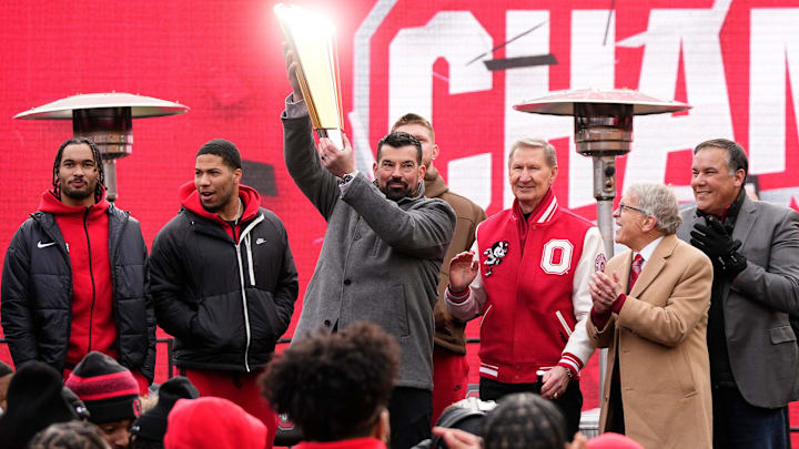Ohio State Buckeyes head coach Ryan Day hoists the championship trophy during the Ohio State Buckeyes College Football Playoff National Championship celebration at Ohio Stadium in Columbus on Jan. 26, 2025.