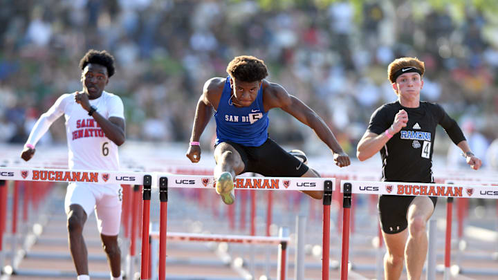 San Diego freshman Jasir Fontenot eyeballs the finish line en route to breaking his own meet record in the 110 high hurdles Saturday in the California (CIF) State Championship at Veteran's Memorial Stadium on the campus of Buchanan High School in Clovis