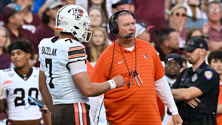 Sep 21, 2024; College Station, Texas, USA; Bowling Green Falcons head coach Scot Loeffler speaks with quarterback Connor Bazelak (7) during the first quarter against the Texas A&M Aggies at Kyle Field. Sep 21, 2024; College Station, Texas, USA; Bowling Green Falcons head coach Scot Loeffler speaks with quarterback Connor Bazelak (7) during the first quarter against the Texas A&M Aggies at Kyle Field.