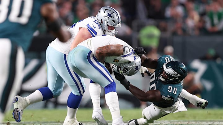 Sep 4, 2025; Philadelphia, Pennsylvania, USA; Dallas Cowboys quarterback Dak Prescott (4) avoids a sack by Philadelphia Eagles defensive tackle Jordan Davis (90) during the second quarter of the game at Lincoln Financial Field. 