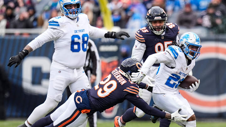 Tyrique Stevenson tries to haul down Jahmyr Gibbs during Detroit's win over the Bears last year at Soldier Field.