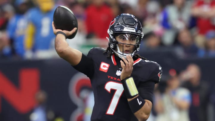 Jan 11, 2025; Houston, Texas, USA; Houston Texans quarterback C.J. Stroud (7) looks to pass during the first quarter against the Los Angeles Chargers in an AFC wild card game at NRG Stadium.