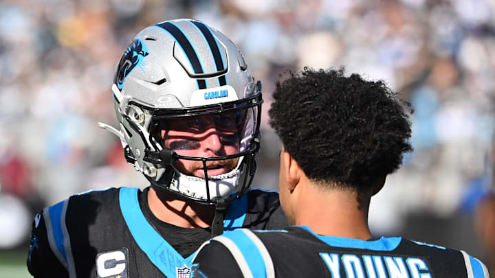 Nov 19, 2023; Charlotte, North Carolina, USA; Carolina Panthers wide receiver Adam Thielen (19) talks to quarterback Bryce Young (9) in the second quarter at Bank of America Stadium. Mandatory Credit: Bob Donnan-Imagn Images