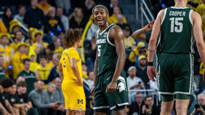 Michigan State’s Tre Holloman (5) celebrates after his team beat Michigan 75 to 62 in their rivalry matchup at Crisler Center in Ann Arbor on Friday, Feb. 21, 2025.