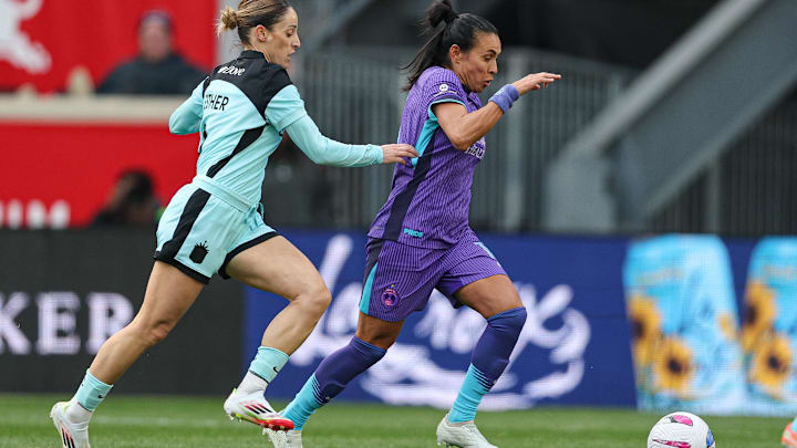 Mar 23, 2025; Harrison, New Jersey, USA; Orlando Pride forward Marta (10) controls the ball against Gotham FC forward Esther Gonzalez (9) during the first half at Sports Illustrated Stadium. Mandatory Credit: Vincent Carchietta-Imagn Images