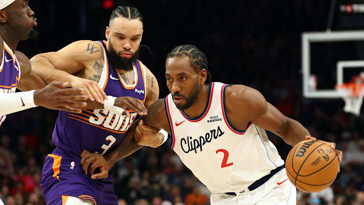Feb 1, 2026; Phoenix, Arizona, USA; Los Angeles Clippers forward Kawhi Leonard (2) against Phoenix Suns forward Dillon Brooks (3) in the first half at Mortgage Matchup Center. Mandatory Credit: Mark J. Rebilas-Imagn Images
