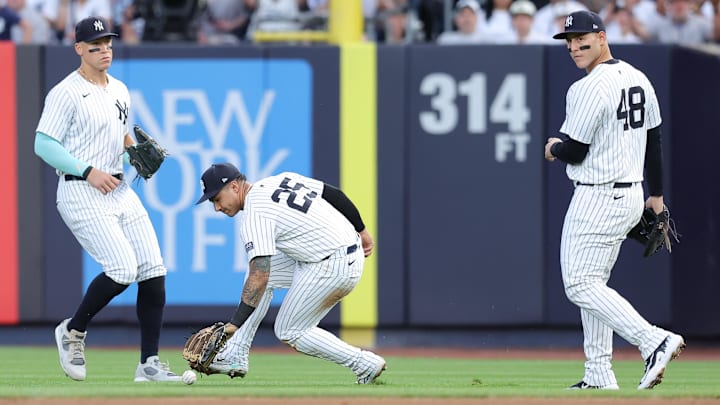 Jun 7, 2024; Bronx, New York, USA; New York Yankees second baseman Gleyber Torres (25) picks up a pop up he dropped for an error by Los Angeles Dodgers third baseman Enrique Hernandez (not pictured) in front of Yankees right fielder Aaron Judge (99) and first baseman Anthony Rizzo (48) during the third inning at Yankee Stadium. Mandatory Credit: Brad Penner-USA TODAY Sports Jun 7, 2024; Bronx, New York, USA; New York Yankees second baseman Gleyber Torres (25) picks up a pop up he dropped for an error by Los Angeles Dodgers third baseman Enrique Hernandez (not pictured) in front of Yankees right fielder Aaron Judge (99) and first baseman Anthony Rizzo (48) during the third inning at Yankee Stadium. Mandatory Credit: Brad Penner-USA TODAY Sports