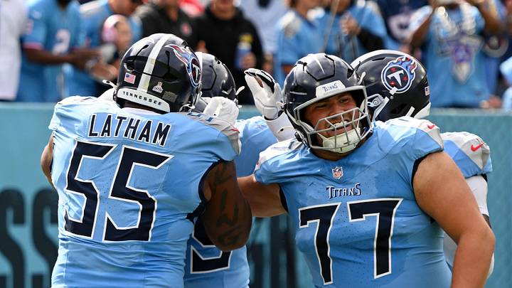 Oct 19, 2025; Nashville, Tennessee, USA; Tennessee Titans offensive tackle Peter Skoronski (77) and teammates celebrates after wide receiver Chimere Dike (17) scored a touchdown against the New England Patriots during the first half at Nissan Stadium. Mandatory Credit: Steve Roberts-Imagn Images