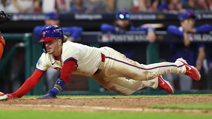 Philadelphia Phillies second base Bryson Stott (5) scores a tun in the eighth inning against the New York Mets during game two of the NLDS for the 2024 MLB Playoffs at Citizens Bank Park. Philadelphia Phillies second base Bryson Stott (5) scores a tun in the eighth inning against the New York Mets during game two of the NLDS for the 2024 MLB Playoffs at Citizens Bank Park.