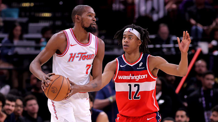 Nov 12, 2025; Houston, Texas, USA; Houston Rockets forward Kevin Durant (7) handles the ball against Washington Wizards guard Tre Johnson (12) during the third quarter at Toyota Center. Mandatory Credit: Erik Williams-Imagn Images