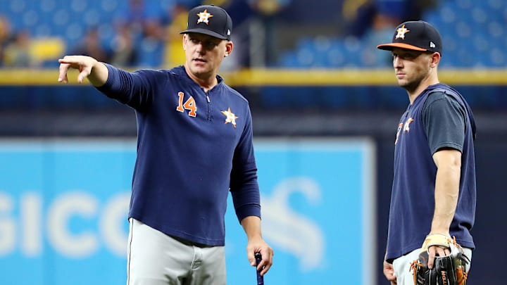 Oct 7, 2019; St. Petersburg, FL, USA; Houston Astros manager AJ Hinch (14) talks with third baseman Alex Bregman (2) during warmups before the game against the Tampa Bay Rays in game three of the 2019 ALDS playoff baseball series at Tropicana Field.