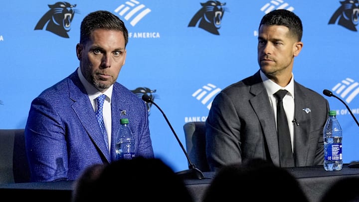 Feb 1, 2024; Charlotte, NC, USA; Carolina Panthers general manager Dan Morgan (left) speaks with new coach Dave Canales during the introductory press conference at Bank of America Stadium. Mandatory Credit: Jim Dedmon-Imagn Images