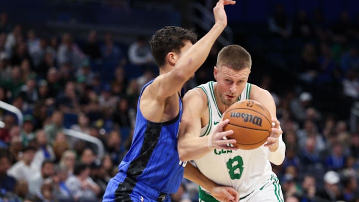 Dec 23, 2024; Orlando, Florida, USA;Boston Celtics center Kristaps Porzingis (8) drives to the basket against the Orlando Magic in the first quarter at Kia Center. Mandatory Credit: Nathan Ray Seebeck-Imagn Images Dec 23, 2024; Orlando, Florida, USA;Boston Celtics center Kristaps Porzingis (8) drives to the basket against the Orlando Magic in the first quarter at Kia Center. Mandatory Credit: Nathan Ray Seebeck-Imagn Images