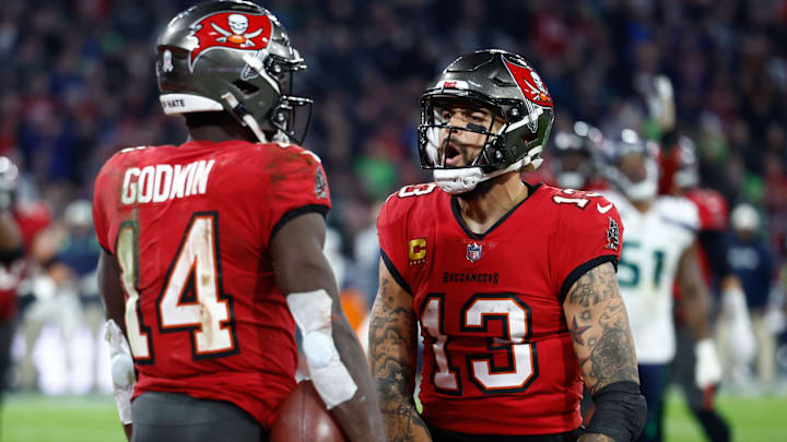 Nov 13, 2022; Munich, Germany, DEU; Tampa Bay Buccaneers wide receiver Chris Godwin (14) celebrates his touchdown with teammate wide receiver Mike Evans (13) against the Seattle Seahawks during the fourth quarter of an International Series game at Allianz Arena. 
