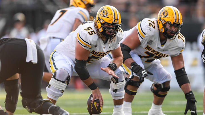 Sep 30, 2023; Nashville, Tennessee, USA; Missouri Tigers offensive lineman Connor Tollison (55) snaps the ball against the Vanderbilt Commodores during the second half at FirstBank Stadium. Mandatory Credit: Steve Roberts-Imagn Images Sep 30, 2023; Nashville, Tennessee, USA; Missouri Tigers offensive lineman Connor Tollison (55) snaps the ball against the Vanderbilt Commodores during the second half at FirstBank Stadium. Mandatory Credit: Steve Roberts-Imagn Images