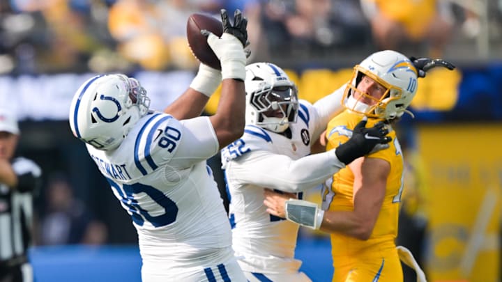 Oct 19, 2025; Inglewood, California, USA; Indianapolis Colts defensive tackle Grover Stewart (90) makes an interception in the first half against the Indianapolis Colts at SoFi Stadium. 