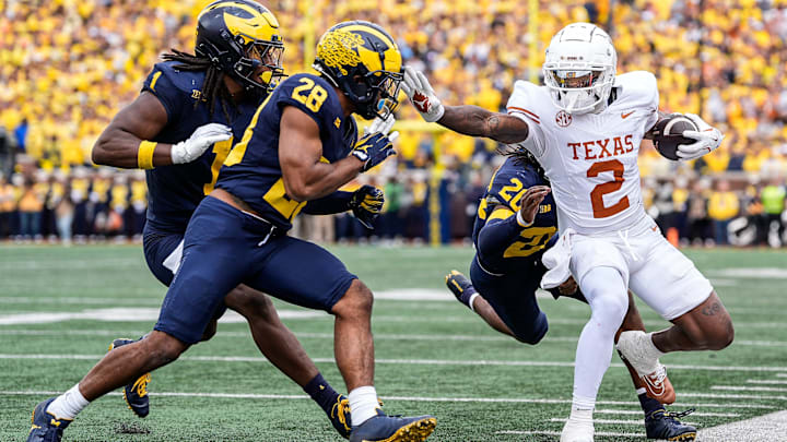 Texas wide receiver Matthew Golden (2) is stopped by Michigan defensive back Jyaire Hill (20), defensive back Quinten Johnson (28) during the first half at Michigan Stadium in Ann Arbor on Saturday, September 7, 2024. Texas wide receiver Matthew Golden (2) is stopped by Michigan defensive back Jyaire Hill (20), defensive back Quinten Johnson (28) during the first half at Michigan Stadium in Ann Arbor on Saturday, September 7, 2024.