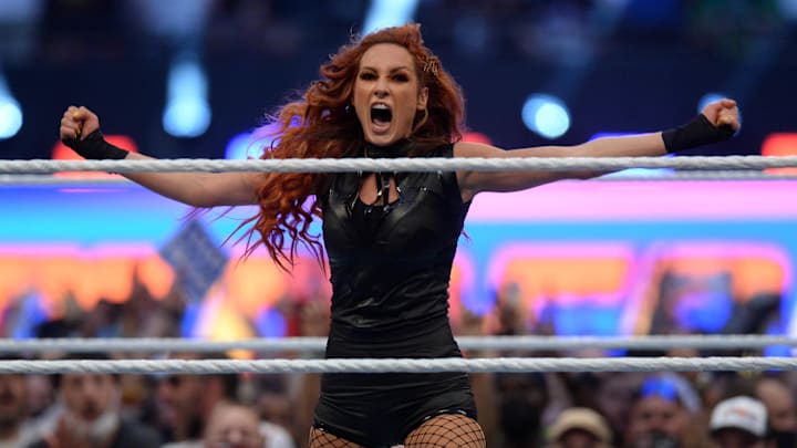 Aug 21, 2021; Paradise, Nevada, USA; Becky Lynch (black attire) returns to WWE to challenge and defeat Bianca Belair (blue/white attire) in the WWE Smackdown Women's Championship match at SummerSlam 2021 at Allegiant Stadium. Mandatory Credit: Joe Camporeale-Imagn Images