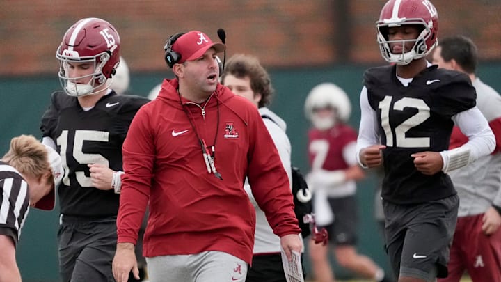 Mar 5, 2025; Tuscaloosa, AL, USA; Quarterbacks coach Nick Seridan walks between quarterbacks Ty Simpson (15) and Keelon Russell (12)during Spring Practice for the Crimson Tide.
