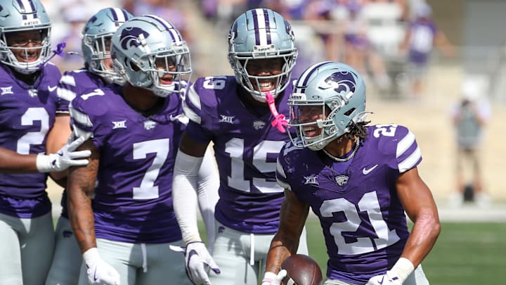 Sep 28, 2024; Manhattan, Kansas, USA; Kansas State Wildcats safety Marques Sigle (21) celebrates after making an interception against the Oklahoma State Cowboys in the third quarter at Bill Snyder Family Football Stadium. Mandatory Credit: Scott Sewell-Imagn Images