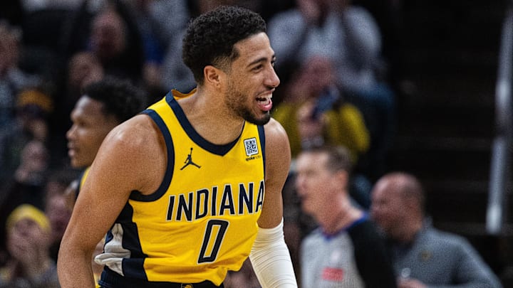 Jan 10, 2025; Indianapolis, Indiana, USA; Indiana Pacers guard Tyrese Haliburton (0) celebrates a basket in the first half Golden State Warriors at Gainbridge Fieldhouse. Mandatory Credit: Trevor Ruszkowski-Imagn Images