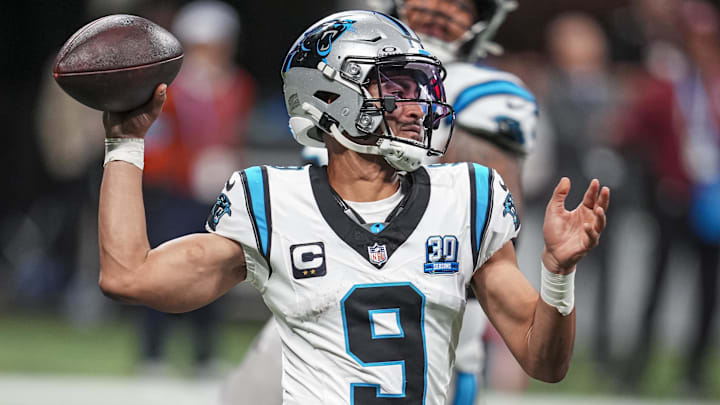 Jan 5, 2025; Atlanta, Georgia, USA; Carolina Panthers quarterback Bryce Young (9) passes on the run against the Atlanta Falcons during the second half at Mercedes-Benz Stadium. Mandatory Credit: Dale Zanine-Imagn Images