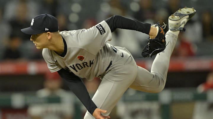 May 26, 2025; Anaheim, California, USA;  New York Yankees relief pitcher Luke Weaver (30) delivers to the plate in the ninth inning against the Los Angeles Angels at Angel Stadium. Mandatory Credit: Jayne Kamin-Oncea-Imagn Images