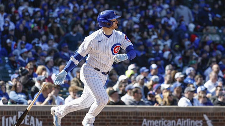 Apr 7, 2023; Chicago, Illinois, USA; Chicago Cubs left fielder Ian Happ (8) hits an RBI-double